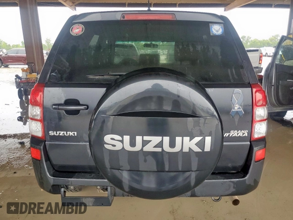2011 Suzuki Grand Vitara Premium with VIN JS3TD0D28B4102365, listed as a Copart auction lot 60560495 with 176,190 mi miles and Salvage title. Bid and sale history available at DreamBid. Image 6.