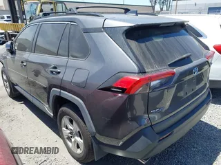 2020 Toyota RAV4 Hybrid XLE with VIN 2T3RWRFV5LW058103, listed as a IAAI auction lot 42665299 with 112,634 mi miles and . Bid and sale history available at DreamBid. Image 3.