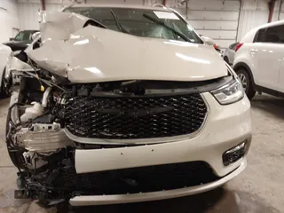 2021 Chrysler Pacifica Touring L with VIN 2C4RC1BG7MR531772, listed as a IAAI auction lot 41834392 with 156,123 mi miles and . Bid and sale history available at DreamBid. Image 12.