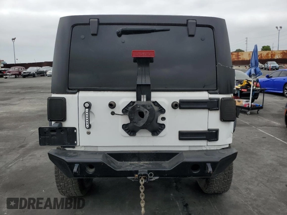 2018 Jeep Wrangler Unlimited Sport S with VIN 1C4BJWDG9JL887033, listed as a Copart auction lot 61785565 with 66,725 mi miles and Salvage title. Bid and sale history available at DreamBid. Image 6.