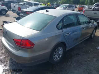 2014 Volkswagen Passat Wolfsburg Ed with VIN 1VWAT7A38EC089882, listed as a IAAI auction lot 41945624 with 130,162 mi miles. Bid and sale history available at carsss.com. Image 4.