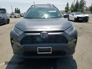 2020 Toyota RAV4 Hybrid XLE with VIN JTMRWRFV7LD063381, listed as a Copart auction lot 60661275 with 70,544 mi miles and Salvage title. Bid and sale history available at DreamBid. Image 14.