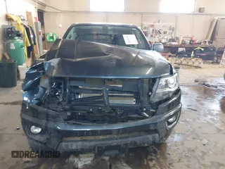 2019 Chevrolet Colorado 4WD Z71 z VIN 1GCGTDEN9K1299292, wystawiony jako IAAI lot #41626944 z przebiegiem 84 949 mil mil oraz . Historia ofert i sprzedaży dostępna na DreamBid. Obrazek 6.
