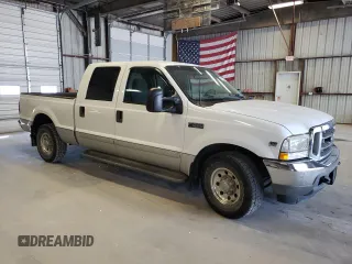 2002 Ford F-250 XL with VIN 1FTNW20S72EB45107, listed as a Copart auction lot 69238304 with 205,294 mi miles and Salvage Title. Bid and sale history available at DreamBid. Image 4.