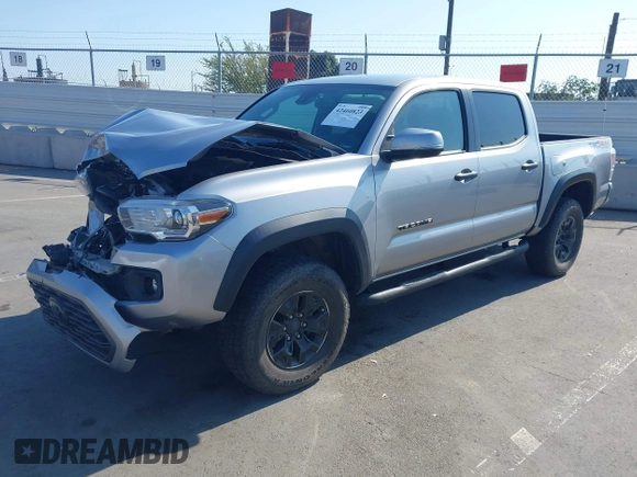 2021 Toyota Tacoma SR with VIN 5TFCZ5AN6MX270972, listed as a IAAI auction lot 42460823 with 76,062 mi miles and . Bid and sale history available at DreamBid. Image 2.