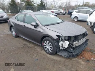 2021 Toyota Camry Hybrid LE with VIN 4T1C31AK4MU557997, listed as a IAAI auction lot 41863503 with 121,270 mi miles. Bid and sale history available at carsss.com. Image 1.