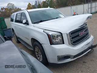 2019 GMC Yukon XL SLT with VIN 1GKS2GKC7KR165419, listed as a IAAI auction lot 40977930 with 167,195 mi miles and . Bid and sale history available at carsss.com. Image 1.