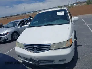 2003 Honda Odyssey EX-L z VIN 5FNRL18033B095684, wystawiony jako IAAI lot #42289617 z przebiegiem 174 336 mil mil oraz . Historia ofert i sprzedaży dostępna na DreamBid. Obrazek 12.
