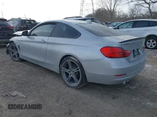 2015 BMW 4 Series 428i xDrive with VIN WBA3N9C53FK247985, listed as a IAAI auction lot 41395534 with 76,856 mi miles and . Bid and sale history available at DreamBid. Image 3.