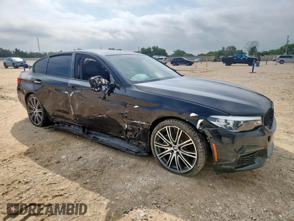 2018 BMW 5 Series 540i xDrive with VIN WBAJE7C52JWD52730, listed as a Copart auction lot 60297425 with 104,208 mi miles and Salvage title. Bid and sale history available at DreamBid. Image 4.