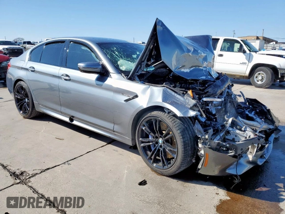 2018 BMW M5 z VIN WBSJF0C50JB282469, wystawiony jako Copart lot #46794335 z przebiegiem Nie podano mil oraz Szkody całkowita. Historia ofert i sprzedaży dostępna na DreamBid. Obrazek 4.