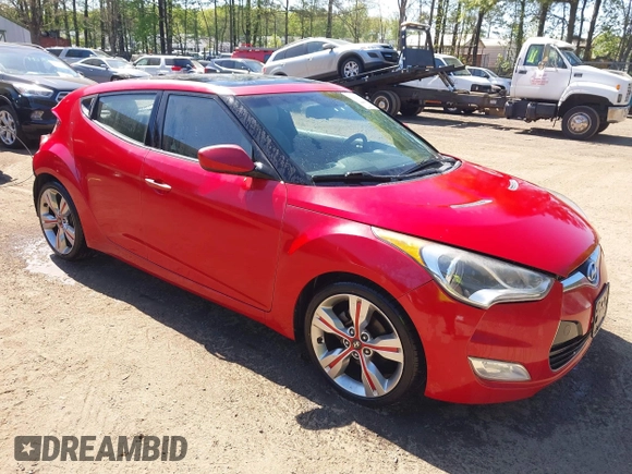 2012 Hyundai Veloster w/Gray Int z VIN KMHTC6AD0CU048339, wystawiony jako IAAI lot #42040008 z przebiegiem 117 895 mil mil oraz . Historia ofert i sprzedaży dostępna na DreamBid. Obrazek 1.
