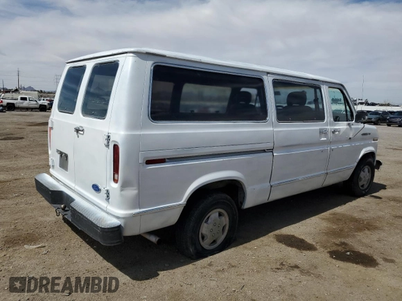 1989 Ford Econoline Cargo with VIN 1FTEE14Y2KHC41026, listed as a Copart auction lot 49440055 with 54,481 mi miles and Salvage Title. Bid and sale history available at DreamBid. Image 3.