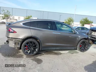 2016 Tesla Model X P90D with VIN 5YJXCAE45GF000773, listed as a IAAI auction lot 42052642 with 127,670 mi miles. Bid and sale history available at carsss.com. Image 14.