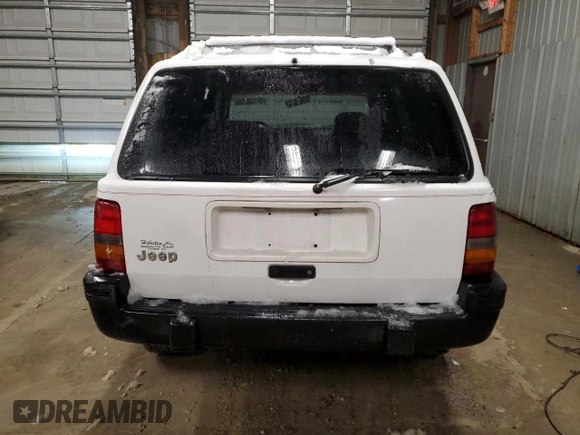 1995 Jeep Grand Cherokee Laredo with VIN 1J4GZ58S6SC630947, listed as a Copart auction lot 82143564 with 267,946 mi miles and Salvage Title. Bid and sale history available at carsss.com. Image 6.