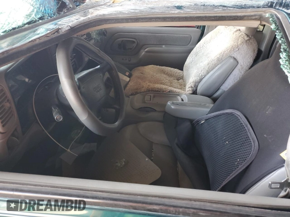1997 GMC Sierra 1500 z VIN 2GTEK19RXV1501674, wystawiony jako Copart lot #59061595 z przebiegiem 138 998 mil mil oraz Szkoda całkowita • Salvage title. Historia ofert i sprzedaży dostępna na DreamBid. Obrazek 7.