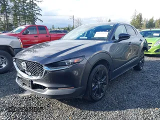 2021 Mazda CX-30 Premium with VIN 3MVDMBDY2MM239231, listed as a IAAI auction lot 41655159 with 22,679 mi miles and . Bid and sale history available at carsss.com. Image 2.