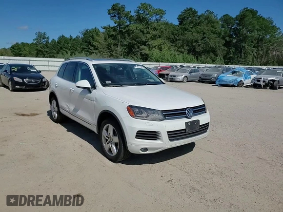 2014 Volkswagen Touareg Lux z VIN WVGEF9BP4ED011436, wystawiony jako Copart lot #74207144 z przebiegiem 207 059 mil mil oraz Szkoda całkowita • Salvage title. Historia ofert i sprzedaży dostępna na DreamBid. Obrazek 11.