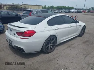 2015 BMW M6 z VIN WBS6C9C50FD467538, wystawiony jako IAAI lot #42366043 z przebiegiem 66 379 mil mil oraz . Historia ofert i sprzedaży dostępna na DreamBid. Obrazek 4.