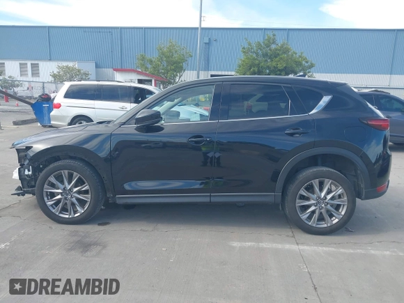 2021 Mazda CX-5 Grand Touring with VIN JM3KFBDM4M1426197, listed as a IAAI auction lot 42004644 with 43,814 mi miles. Bid and sale history available at carsss.com. Image 15.