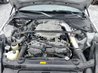 2004 Nissan 350Z Touring z VIN JN1AZ34E84T063971, wystawiony jako Copart lot #57267825 z przebiegiem 131 036 mil mil oraz Szkoda całkowita • Salvage title. Historia ofert i sprzedaży dostępna na DreamBid. Obrazek 11.