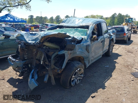 2023 Ford F-150 XL with VIN 1FTFW1E53PKD99214, listed as a IAAI auction lot 42211755 with 31 mi miles and . Bid and sale history available at DreamBid. Image 2.