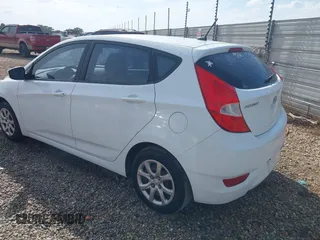 2014 Hyundai Accent GS with VIN KMHCT5AE6EU157751, listed as a IAAI auction lot 42161112 with 145,653 mi miles. Bid and sale history available at carsss.com. Image 3.