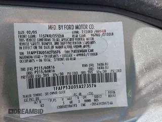 2005 Ford Taurus SE with VIN 1FAFP53U05A273576, listed as a IAAI auction lot 42140404 with 58,735 mi miles. Bid and sale history available at carsss.com. Image 9.