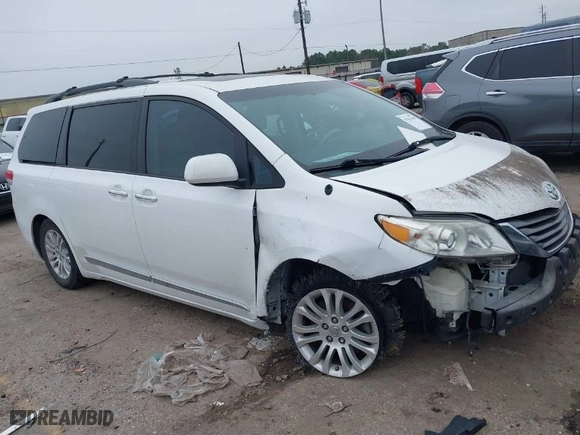2014 Toyota Sienna XLE with VIN 5TDYK3DC5ES437127, listed as a IAAI auction lot 41561709 with 119,514 mi miles. Bid and sale history available at carsss.com. Image 1.