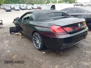 2014 BMW 6 Series 640i z VIN WBALW7C5XED595934, wystawiony jako IAAI lot #42092380 z przebiegiem Nie podano mil oraz . Historia ofert i sprzedaży dostępna na DreamBid. Obrazek 3.