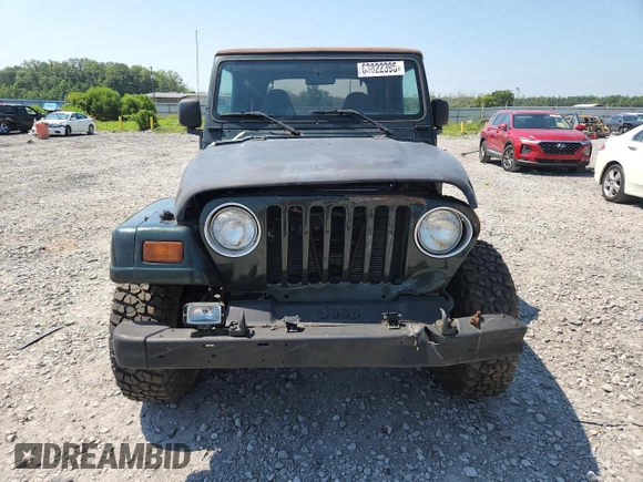 1997 Jeep Wrangler Sahara with VIN 1J4FY49S3VP519387, listed as a Copart auction lot 63822395 with 187,884 mi miles and Salvage title. Bid and sale history available at DreamBid. Image 5.