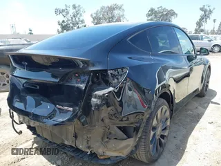 2021 Tesla Model Y Performance with VIN 5YJYGDEF1MF092889, listed as a IAAI auction lot 42076715 with 48,373 mi miles and . Bid and sale history available at DreamBid. Image 4.