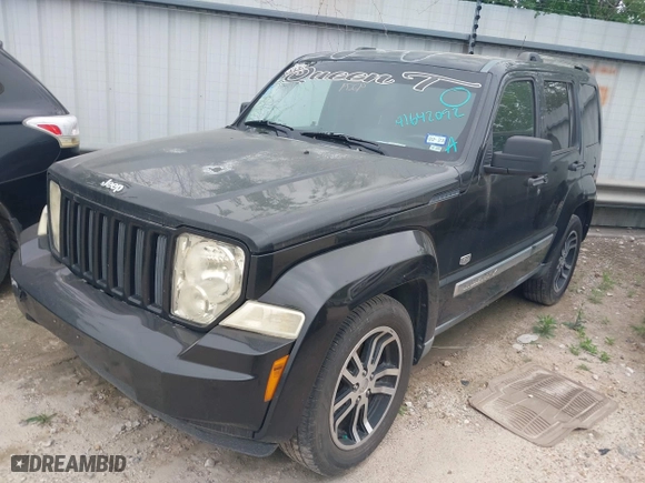 2011 Jeep Liberty Sport with VIN 1J4PP2GK0BW559054, listed as a IAAI auction lot 41642092 with 273,927 mi miles. Bid and sale history available at carsss.com. Image 2.