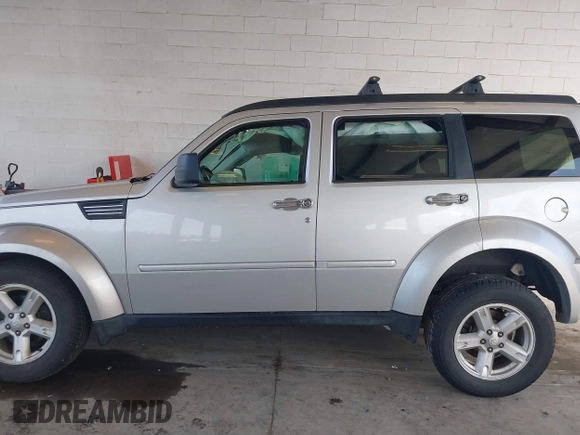 2007 Dodge Nitro SLT with VIN 1D8GU58K97W616701, listed as a IAAI auction lot 41666666 with 174,052 mi miles and . Bid and sale history available at carsss.com. Image 14.