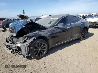 2014 Tesla Model S 60 z VIN 5YJSA1H13EFP38425, wystawiony jako Copart lot #63686205 z przebiegiem 183 968 mil mil oraz Szkoda całkowita • Salvage title. Historia ofert i sprzedaży dostępna na DreamBid. Obrazek 1.