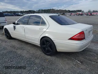 2003 Mercedes-Benz S-Class 4.3L with VIN WDBNG70J83A318268, listed as a IAAI auction lot 41380963 with 243,734 mi miles. Bid and sale history available at carsss.com. Image 3.