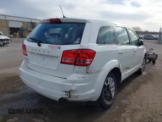2014 Dodge Journey American Value with VIN 3C4PDCAB1ET209973, listed as a IAAI auction lot 41803864 with 168,774 mi miles and . Bid and sale history available at DreamBid. Image 4.