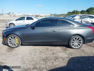 2016 Cadillac ATS Coupe Luxury Collection AWD with VIN 1G6AH1RX6G0109787, listed as a IAAI auction lot 41151839 with 71,573 mi miles. Bid and sale history available at carsss.com. Image 14.