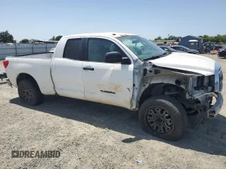2012 Toyota Tundra with VIN 5TFRM5F14CX039145, listed as a Copart auction lot 56520015 with 129,114 mi miles and Salvage title. Bid and sale history available at DreamBid. Image 4.