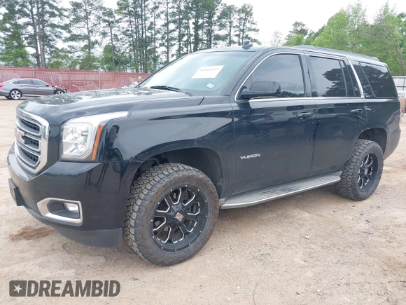 2015 GMC Yukon SLT with VIN 1GKS1BKC5FR274408, listed as a IAAI auction lot 41942157 with 165,978 mi miles. Bid and sale history available at carsss.com. Image 2.
