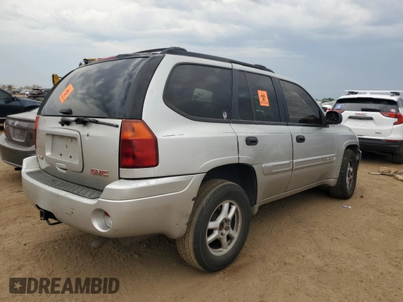 2005 GMC Envoy SLT with VIN 1GKDT13S152124404, listed as a Copart auction lot 64011494 with 212,951 mi miles and Salvage Title. Bid and sale history available at DreamBid. Image 3.