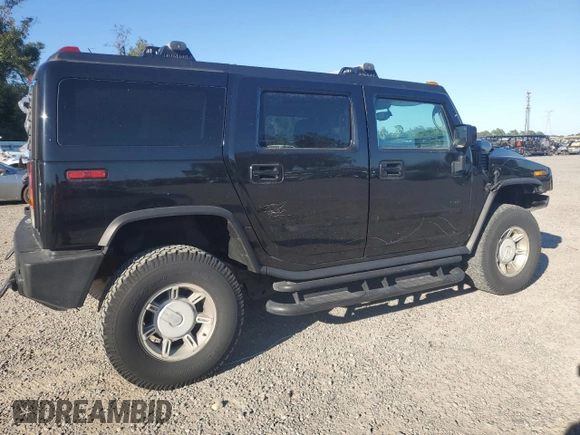 2003 Hummer H2 with VIN 5GRGN23UX3H136571, listed as a Copart auction lot 80823054 with 220,003 mi miles and Salvage Title. Bid and sale history available at carsss.com. Image 3.
