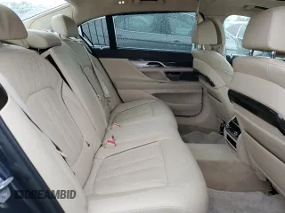 2016 BMW 7 Series 750i with VIN WBA7F0C54GGL99661, listed as a Copart auction lot 71742154 with 104,498 mi miles and Salvage Title. Bid and sale history available at carsss.com. Image 10.
