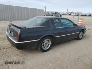1999 Cadillac Eldorado Touring z VIN 1G6ET1298XU602343, wystawiony jako Copart lot #44327195 z przebiegiem 52 327 mil mil oraz Szkody całkowita. Historia ofert i sprzedaży dostępna na DreamBid. Obrazek 3.