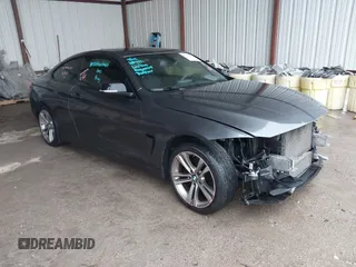 2014 BMW 4 Series 428i xDrive z VIN WBA3N9C58EF721128, wystawiony jako IAAI lot #42189868 z przebiegiem 126 384 mil mil oraz . Historia ofert i sprzedaży dostępna na DreamBid. Obrazek 1.
