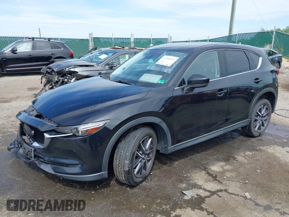 2018 Mazda CX-5 Grand Touring z VIN JM3KFBDM5J0307785, wystawiony jako IAAI lot #42302609 z przebiegiem 81 974 mil mil oraz . Historia ofert i sprzedaży dostępna na DreamBid. Obrazek 18.