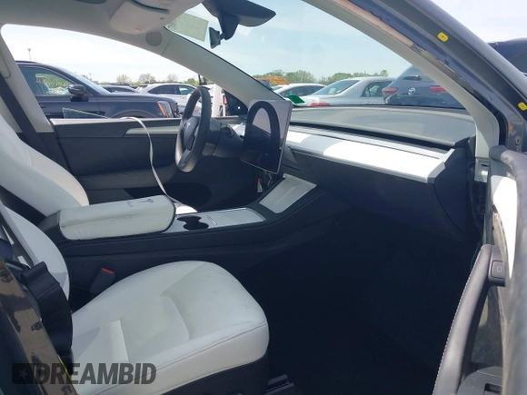 2023 Tesla Model Y Long Range z VIN 7SAYGDEE1PA158661, wystawiony jako IAAI lot #41983897 z przebiegiem 20 176 mil mil oraz . Historia ofert i sprzedaży dostępna na DreamBid. Obrazek 5.