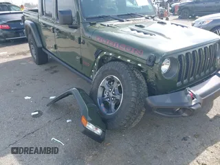 2023 Jeep Gladiator Rubicon with VIN 1C6JJTBGXPL586154, listed as a IAAI auction lot 41370352 with 11,207 mi miles and . Bid and sale history available at DreamBid. Image 6.