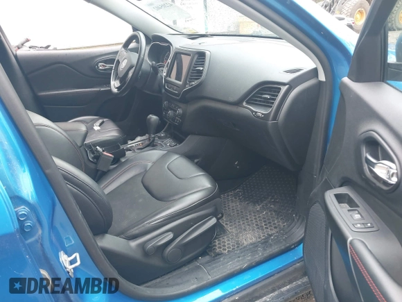 2021 Jeep Cherokee Trailhawk with VIN 1C4PJMBXXMD173102, listed as a IAAI auction lot 42205402 with 57,321 mi miles and . Bid and sale history available at DreamBid. Image 5.