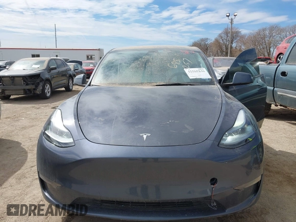 2022 Tesla Model Y Long Range with VIN 7SAYGDEE5NF534259, listed as a IAAI auction lot 41860246 with 24,513 mi miles and . Bid and sale history available at carsss.com. Image 6.